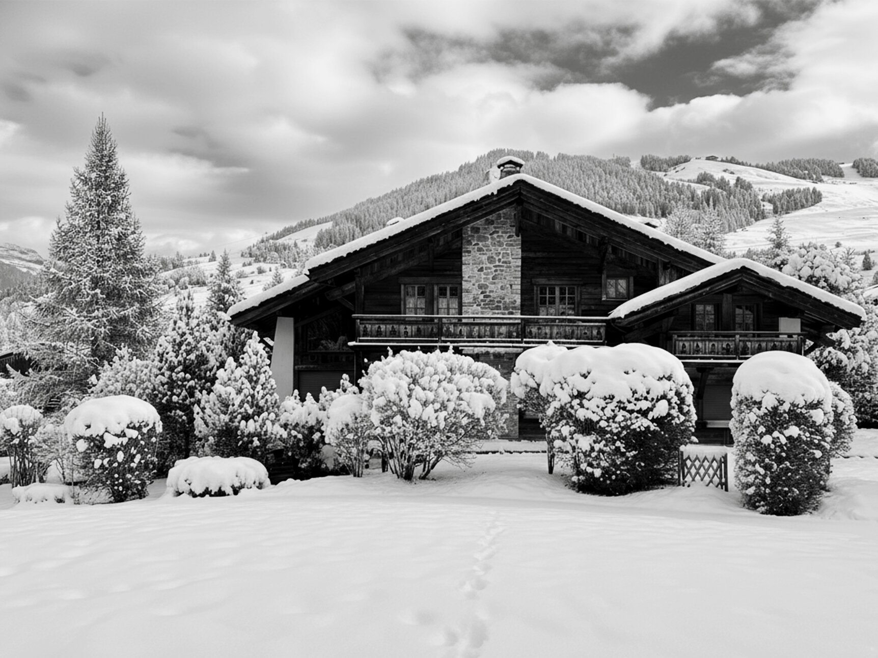 Private chalet in Megève, France — snow-covered alpine exterior at dusk